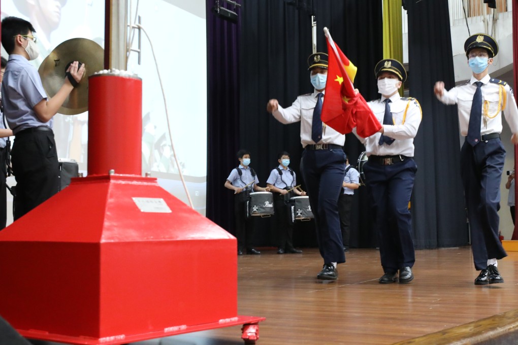 Students take part in a flag-raising ceremony at a school in Ho Man Tin on July 1, 2020. Photo: May Tse