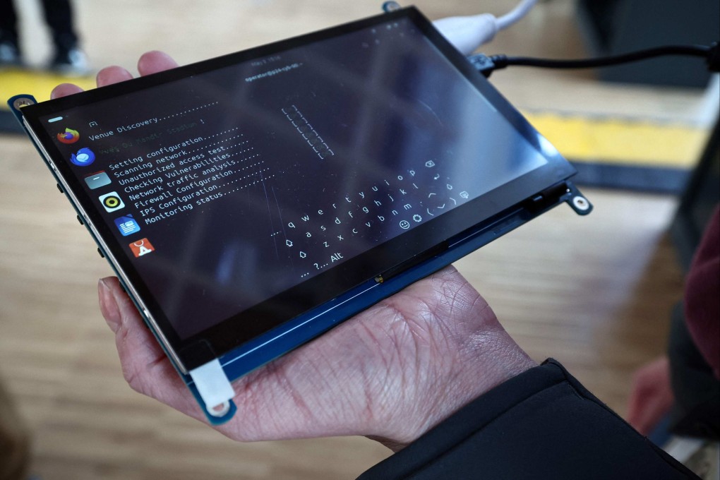 An engineer checks cybersecurity at the Olympic hockey venue in Colombes. Photo: AFP