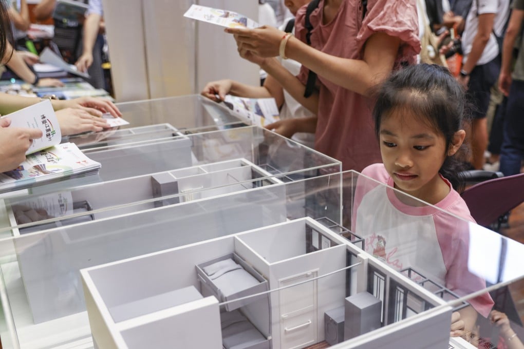 Residents view mock-ups of transitional housing to be offered to those living in subdivided flats. Photo: Yik Yeung-man