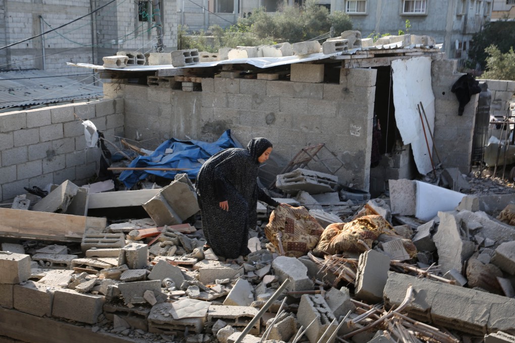 A woman collects items from the rubble of a destroyed building after an Israeli airstrike in the southern Gaza Strip city of Rafah, on May 3, 2024. Photo: Xinhua