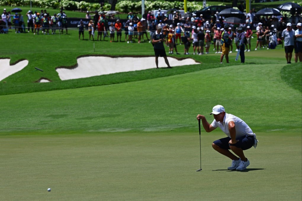 Brooks Koepka reads a putt during the third round in Singapore. Photo: Reuters