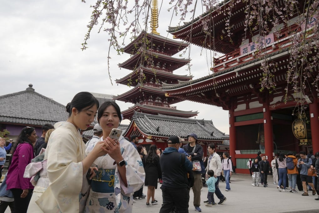 Tourists visit Sensoji Temple in Tokyo’s Asakusa district on April 4. Photo: EPA-EFE