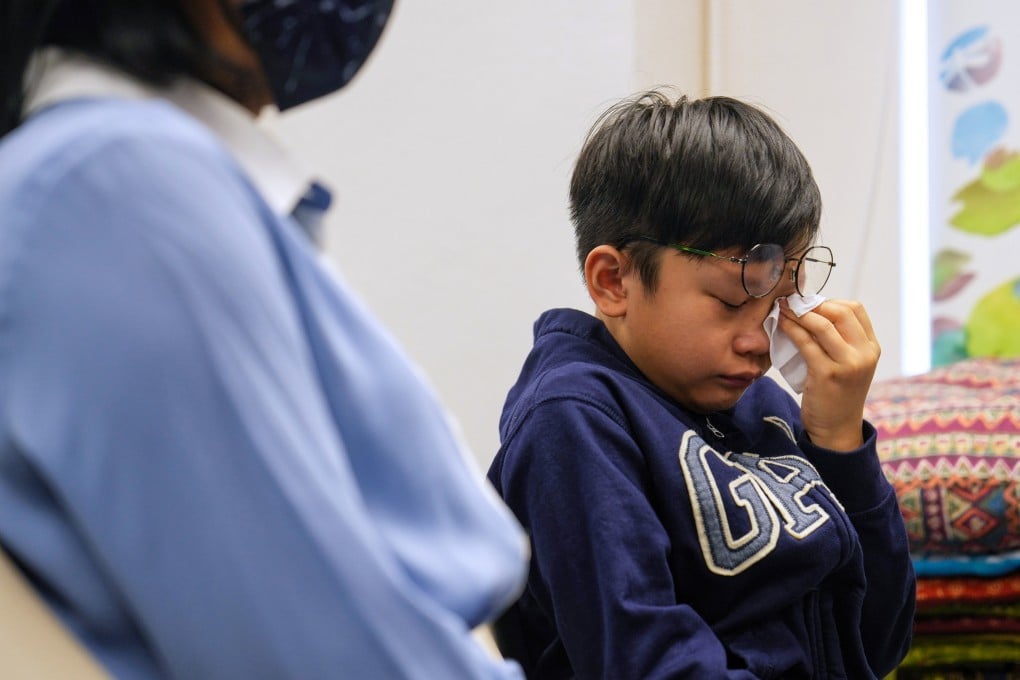 Morris Kwok (right) with his mother. He said he wanted to play hide and seek, basketball and go swimming with Yat-lai in the virtual world. Photo: Elson Li