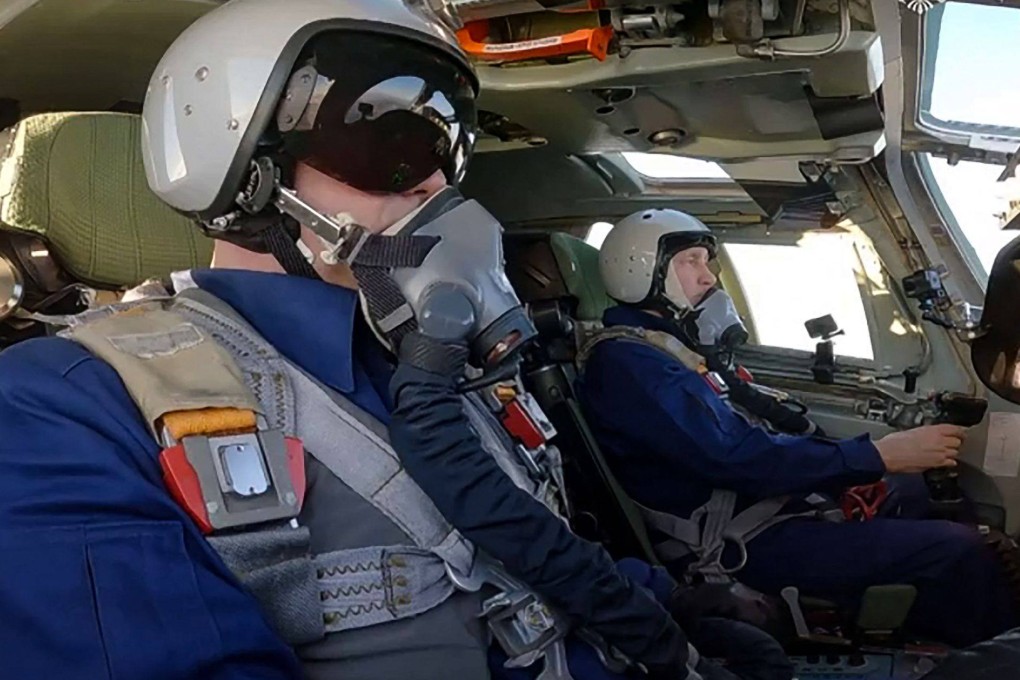 Russian President Vladimir Putin (right) sits in a Tupolev Tu-160M strategic bomber in February. Photo: Russian Presidential Press Office via AFP