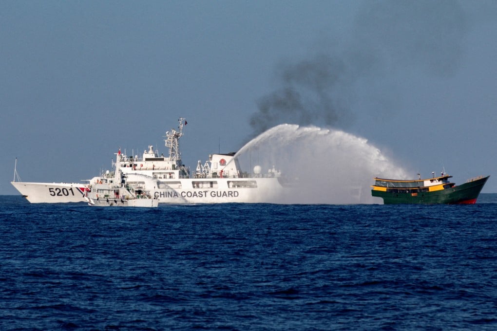 Chinese coastguard vessels fire water cannons towards a Philippine resupply vessel as it makes its way towards the disputed Second Thomas Shoal in the South China Sea in March. Photo: Reuters