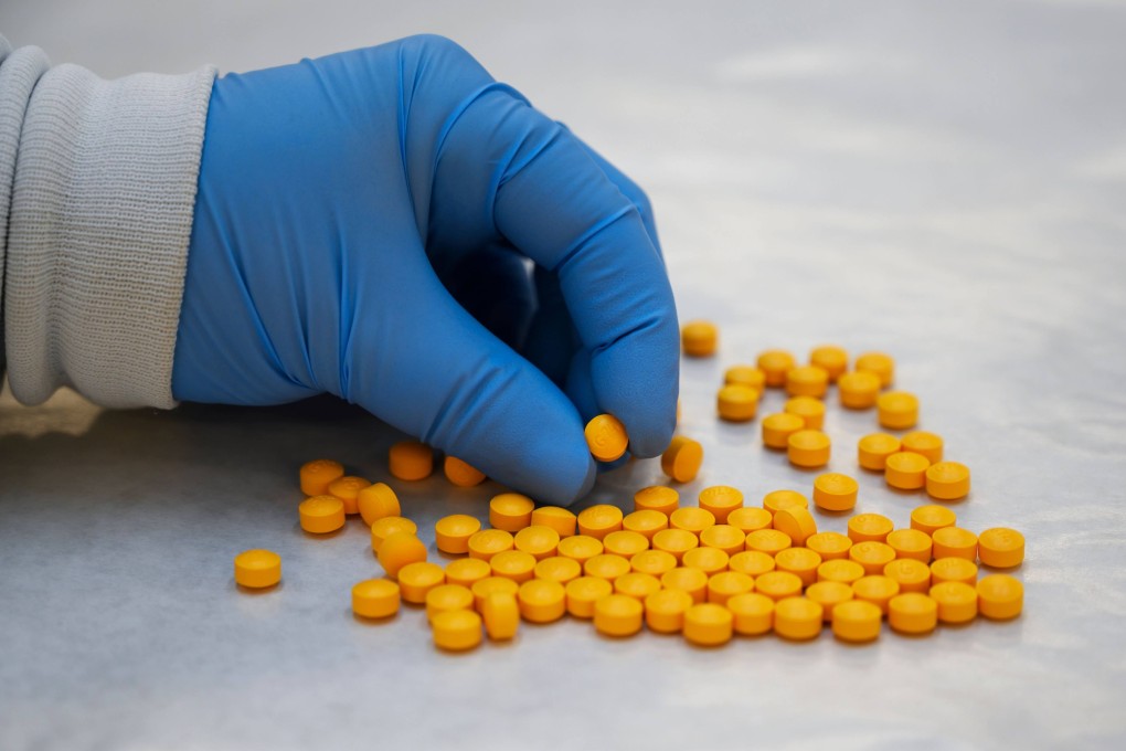 A US Drug Enforcement Administration (DEA) chemist checks confiscated powder containing fentanyl in New York. Photo: AFP/Getty Images/TNS