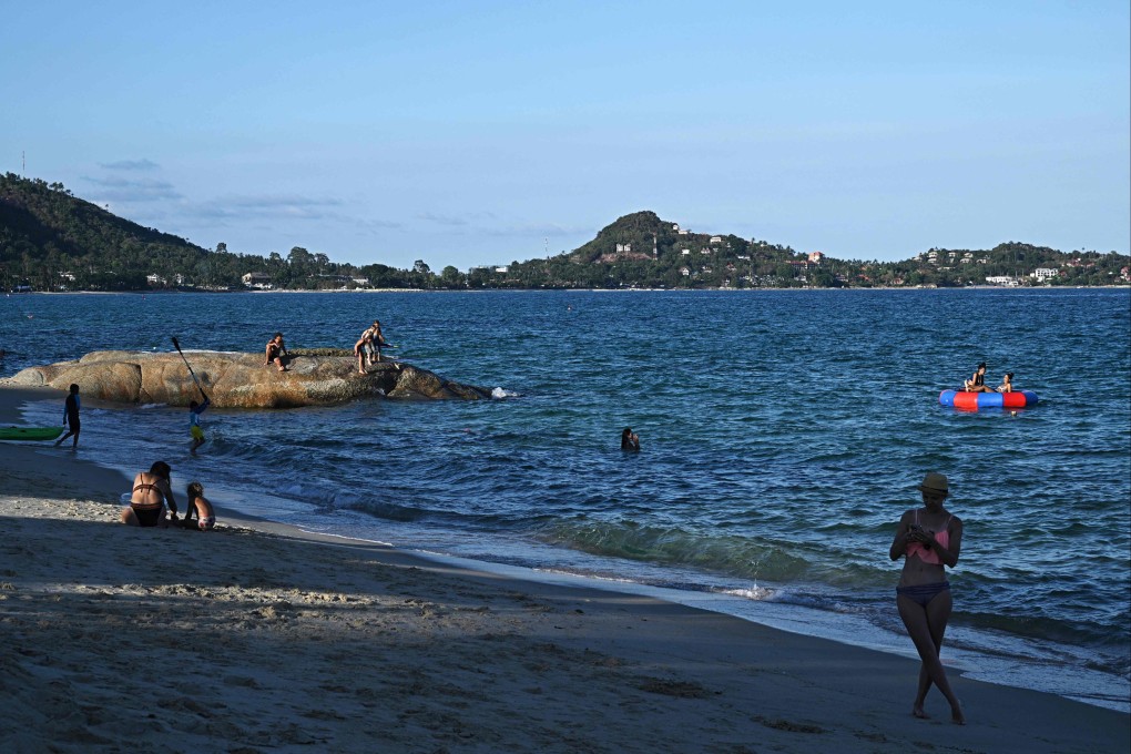 People relax on Lamai beach on Koh Samui island in the southern Thai province of Surat Thani on April 8. Photo: AFP