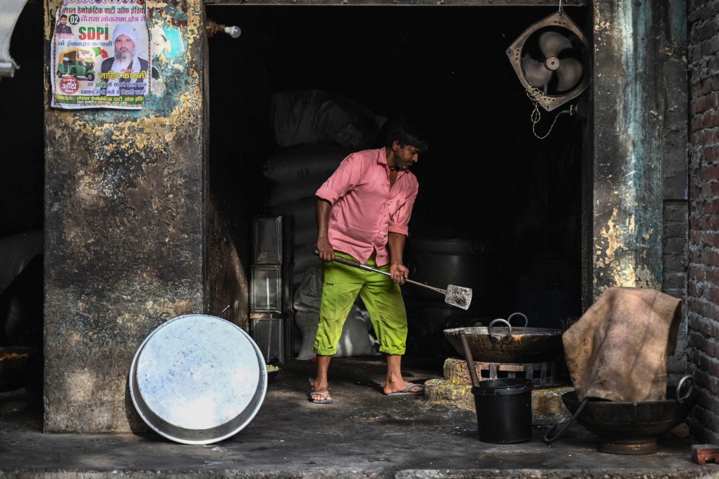A shopkeeper makes sweets in Kairana, Uttar Pradesh state. Voters are questioning if higher economic growth achieved by Prime Minister Narendra Modi’s government is translating into better livelihoods for young people. Photo: AFP