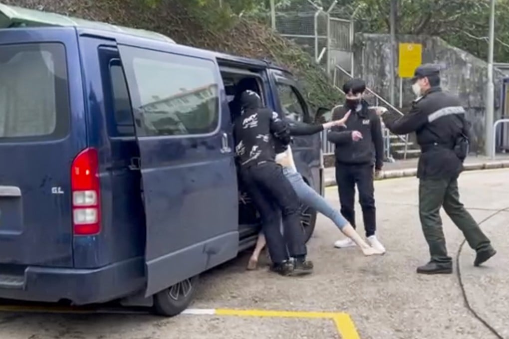 The dramatic moment when a woman was bundled into a van outside Stanley Prison in 2022 as a prison officer tries to intervene. Photo: Handout