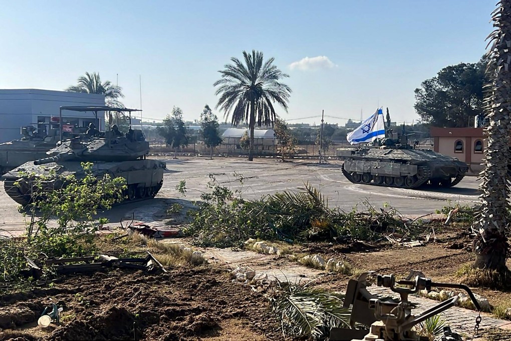 Israeli tanks entering the Palestinian side of the Rafah border crossing between Gaza and Egypt. Photo: Israeli Army via AFP