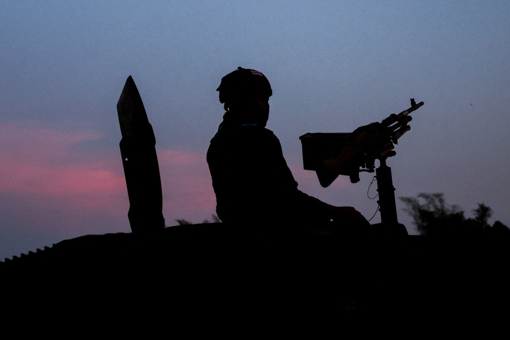 Military personnel stand guard near the river frontier between Myanmar and Thailand. Photo: Reuters