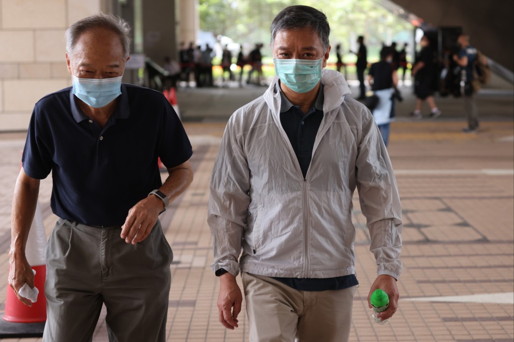 Apple Daily chief operating officer Chow Tat-kuen (white jacket) arrives at West Kowloon Magistrates’ Court at an earlier sitting. Photo: May Tse