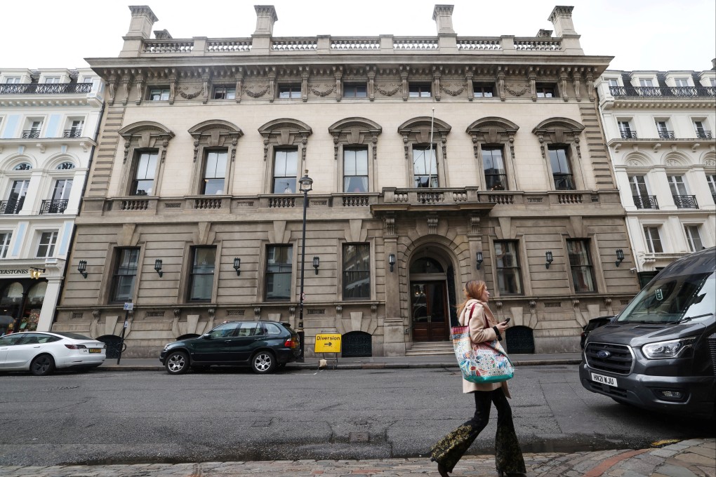 A person walks past the entrance to the Garrick Club, a private member’s club in London, which has voted to finally allow female members. Photo: Reuters