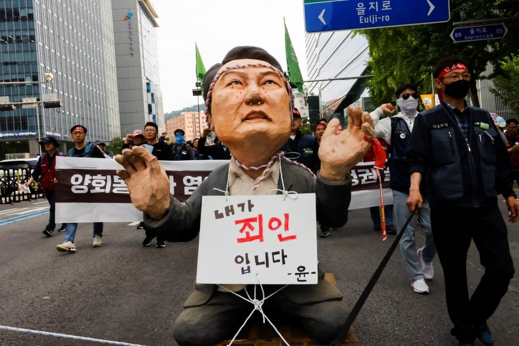 Trade unionists rally in Seoul on May 1 with an effigy of South Korean President Yoon Seok-yeol carrying a sign that reads “I am a sinner”. Yoon has largely shied away from the media spotlight. Photo: Reuters