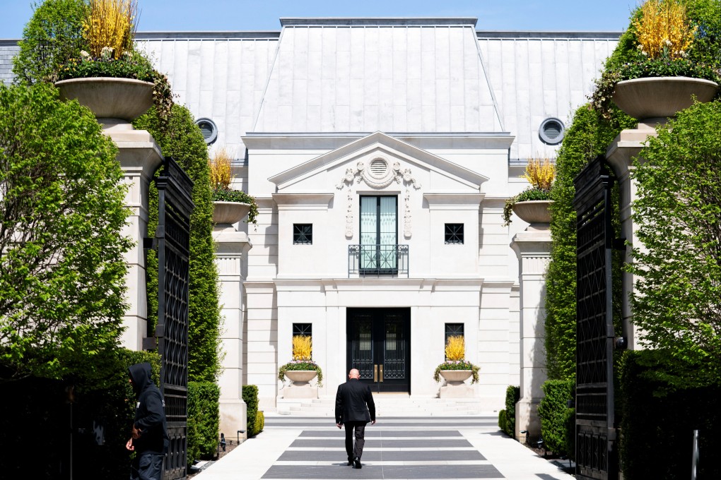 A security guard walks up the driveway of 21 Park Lane Circle after another security guard was shot outside Canadian rap star Drake’s home in Toronto. Photo: Reuters