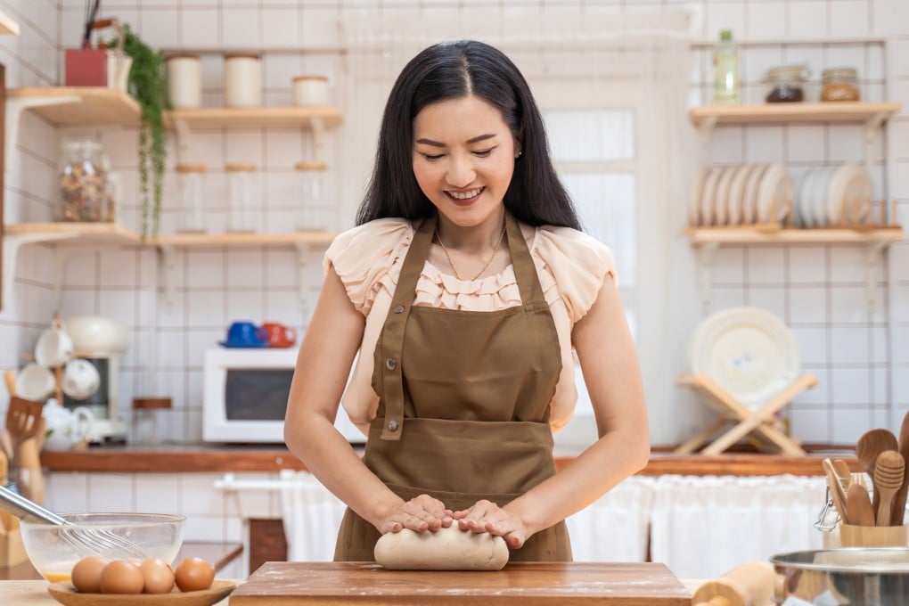 Baking at home is one way people might enjoy JOMO, or the joy of missing out. The antidote to FOMO, JOMO has physical and mental health benefits and can make us happier. Photo: Shutterstock