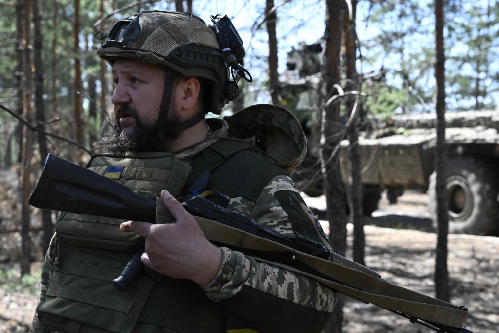 A Ukrainian serviceman waits in a forest for orders amid the Russian invasion of Ukraine. Photo: AFP