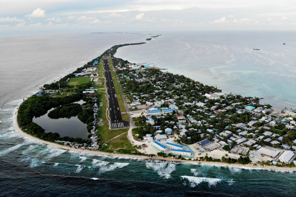 An aerial view of downtown and the airport runway in Funafuti, Tuvalu. Australia  said it will quadruple its financial help to Tuvalu, as China also courts small island states. Photo: Getty Images