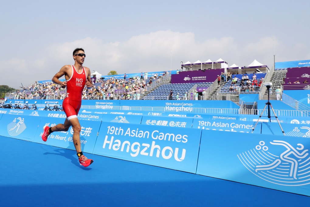 Hong Kong’s Jason Ng runs down the finish chute at the end of the men’s triathlon at the Asian Games in Hangzhou. Photo: SF&OC