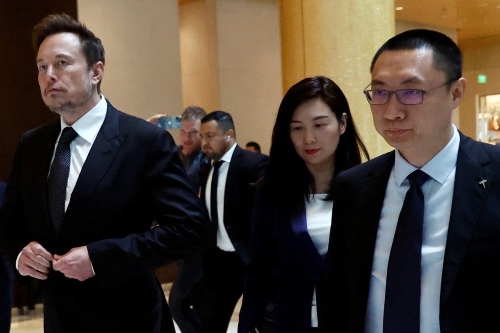 Tesla Chief Executive Officer Elon Musk (left) walks next to Tesla’s Senior Vice-President Tom Zhu (right) and Vice-President Grace Tao as he leaves a hotel in Beijing, China in May 2023. Photo: Reuters