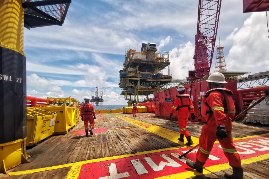 Offshore marine crew stand by on deck during cargo transfer from vessel to oil platform at sea, off Sabah. Malaysia’s maritime assets are notoriously poorly funded and unable to fully patrol waters, analysts say. Photo: Shutterstock