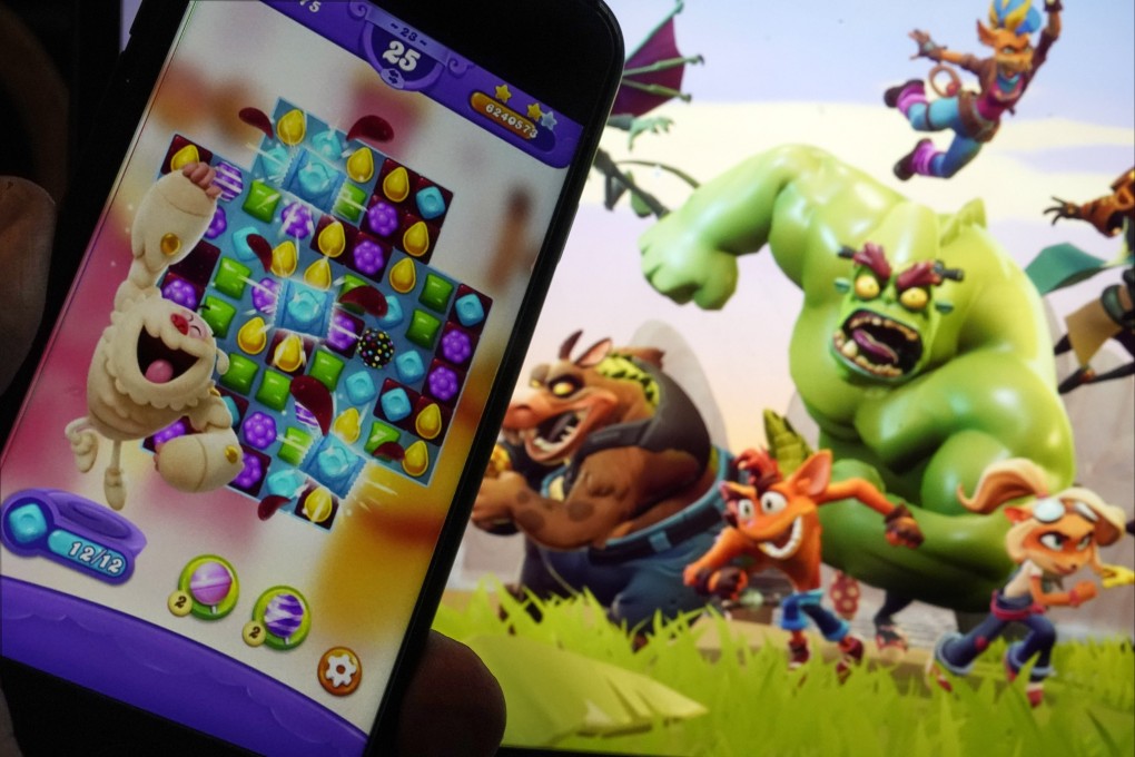 Scenes from Candy Crush Saga, left, and Crash Team Rumble, are shown in this photo, in New York, June 21, 2023. Photo: AP