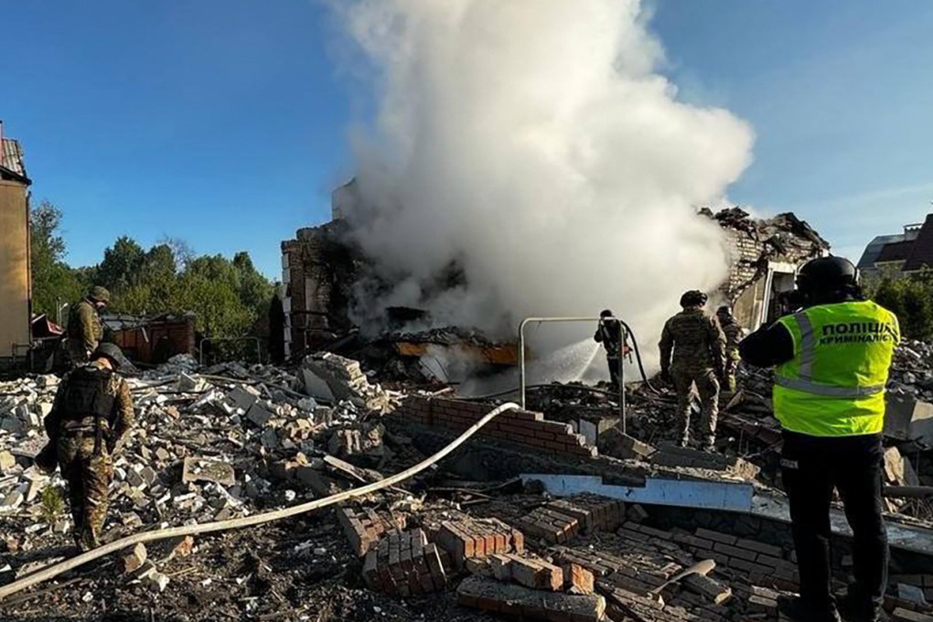 Crews extinguish fires of private houses destroyed by a shelling in Kharkiv, eastern Ukraine. Photo: National Police of Ukraine/AFP