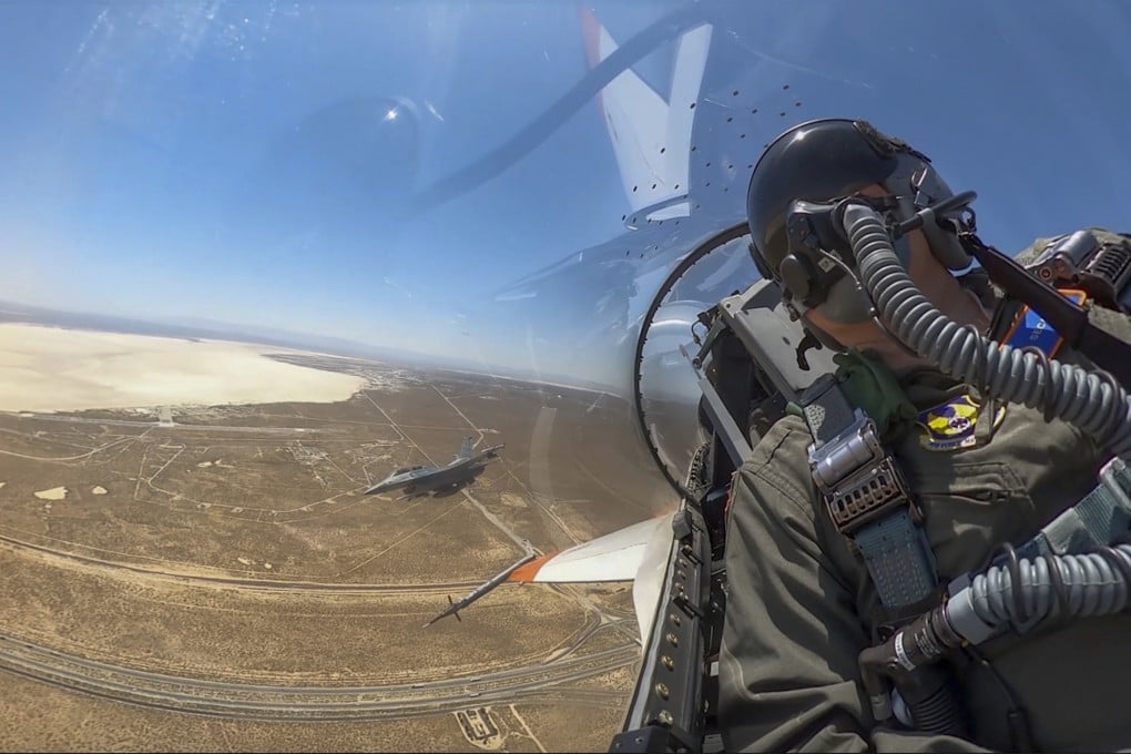 US Air Force Secretary Frank Kendall in the cockpit of an X-62A Vista autonomous warplane, above Edwards Air Base in California last week. Photo: US Air Force via AP