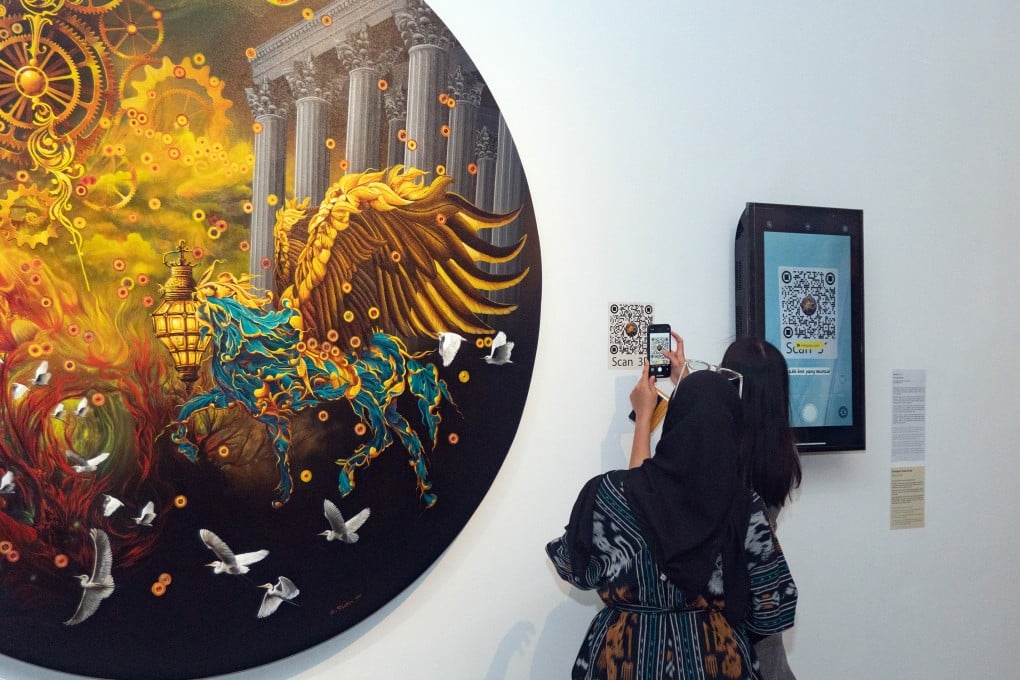 Visitors admiring artworks at the 2023 Biennale Jatim in Indonesia. Photo: Orasis Art Space