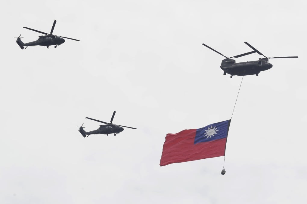 Helicopters fly with Taiwan’s flag on Tuesday, practicing for the presidential inauguration scheduled for May 20. Photo: AP