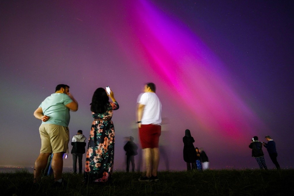The Northern lights glow in the night sky above the village of Daillens, Switzerland, on May 11. Photo: EPA-EFE