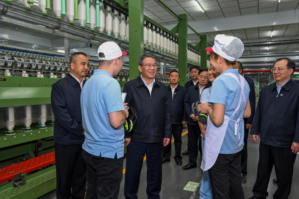 Chinese Premier Li Qiang visits a local company during his tour of Xinjiang. Photo: Xinhua