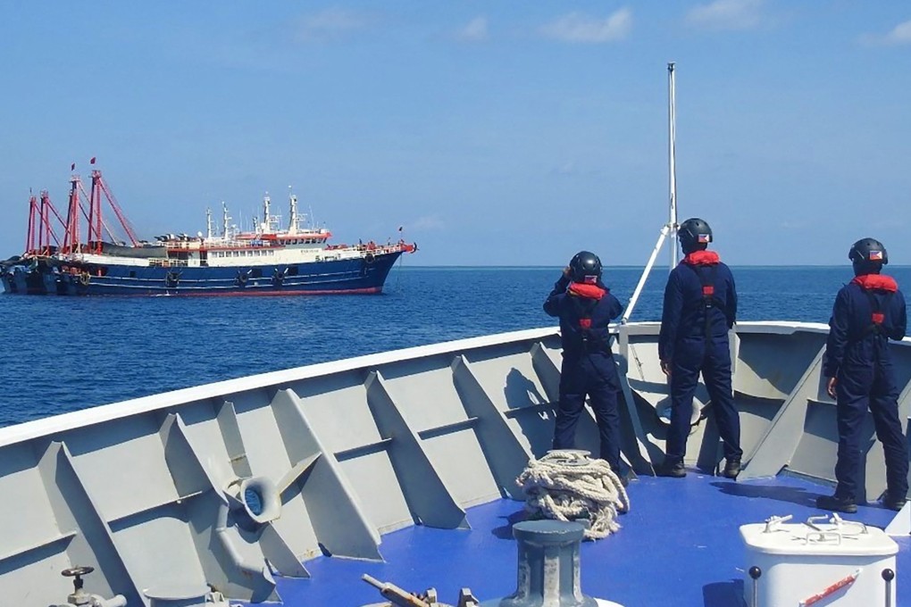 Philippine coastguard personnel aboard their ship BRP Cabra in 2021 monitoring Chinese vessels anchored at Sabina Shoal, a South China Sea outcrop claimed by Manila. Photo: Handout / Philippine Coast Guard / AFP