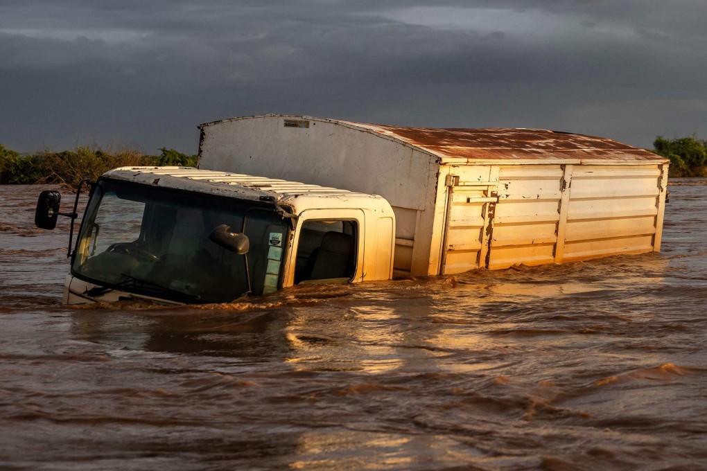 A truck sits submerged in flood waters following the destruction of a main road amid flash floods in Garissa, Kenya, on May 8. Kenya is grappling with one of its worst floods in recent history, the latest in a string of weather catastrophes, following weeks of extreme rainfall scientists have linked to a changing climate. Photo: AFP