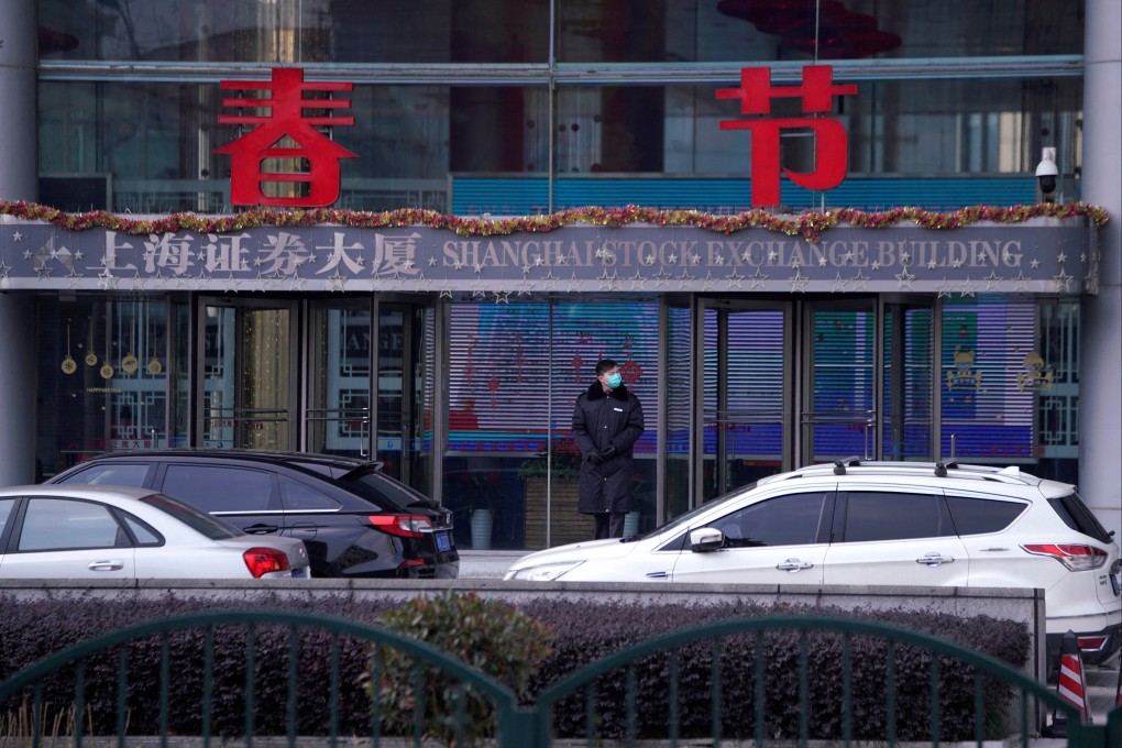 A security guard stands at the Shanghai Stock Exchange building at the Pudong financial district in Shanghai, China, as the country is hit by an outbreak of a new coronavirus. Photo Reuters