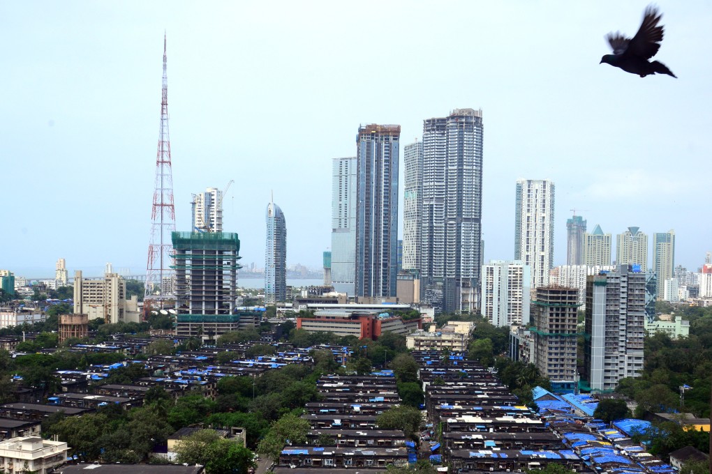 A bird’s eye view of Mumbai shows affordable workers’ accommodation in front of high-rise residential towers. Photo: AFP