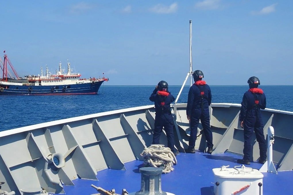 A picture released by the Philippine coastguard shows personnel monitoring Chinese vessels anchored at Sabina Shoal. Photo: AFP