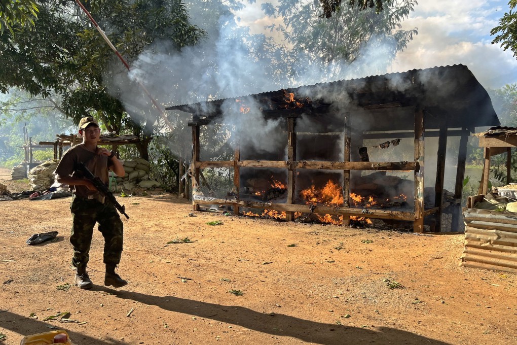 A rebel fighter from the Karenni Nationalities Defence Force walks past a destroyed military outpost in Myanmar’s Karenni state last year. Foreign governments have avoided offering aid to rebel forces for fear of igniting a proxy war. Photo: EPA-EFE