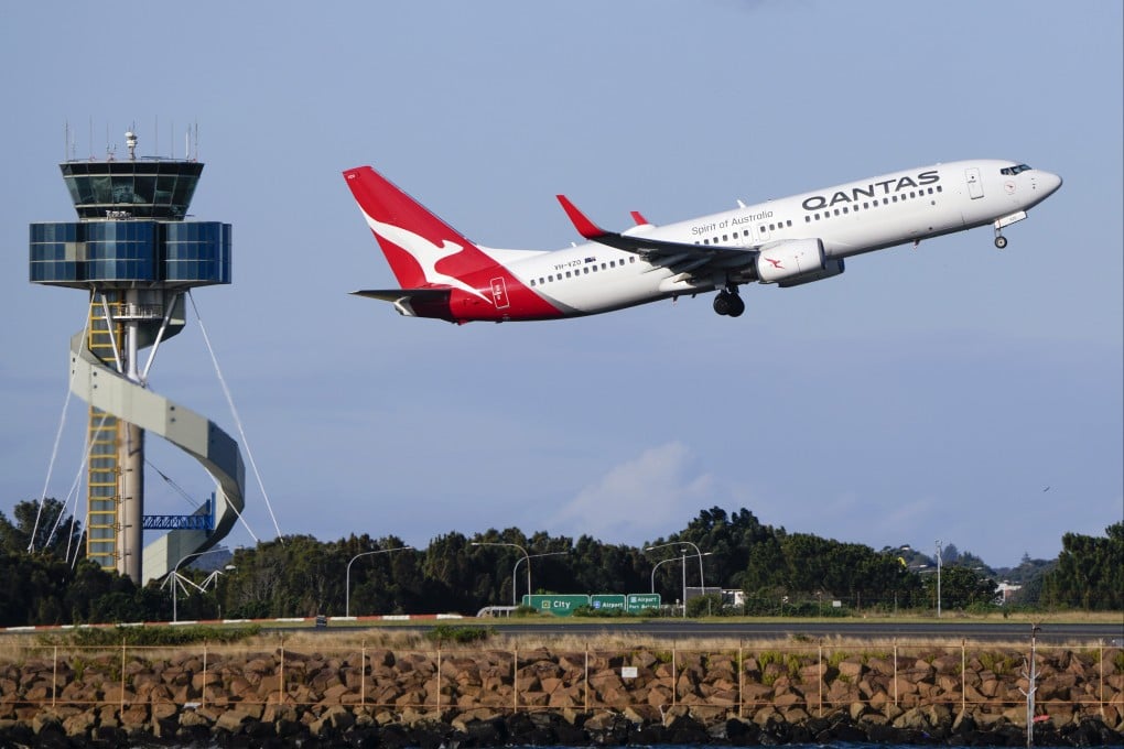 A Qantas Airways passenger plane takes off from Sydney Airport. Photo: AP