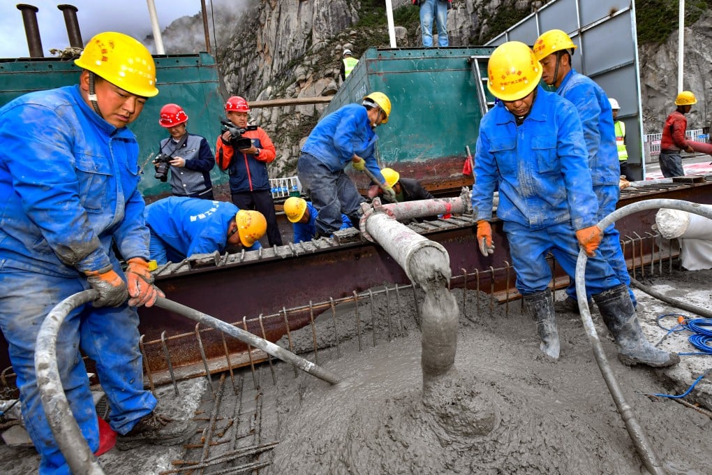 Concrete is poured during construction of a bridge across the Yarlung Zangbo river in southwest China’s Tibet autonomous region in June 2020. China’s cement sector needs to urgently cut emissions. Photo: Xinhua