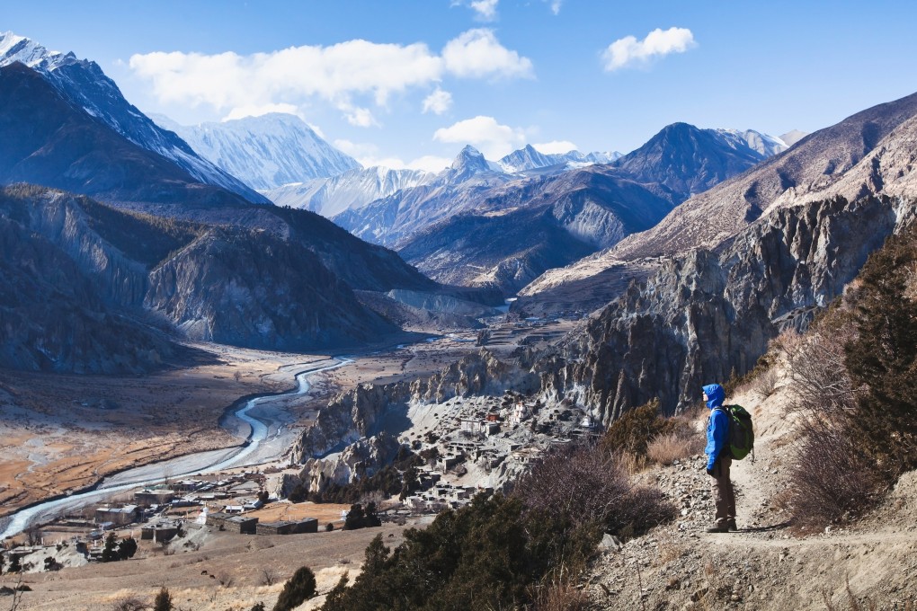 A hiker looks out at mountains on the Annapurna Circuit in Nepal, a location on Post Magazine’s hypothetical world’s longest walk, inspired by Russ Cook’s epic run across the length of Africa. Photo: Shutterstock