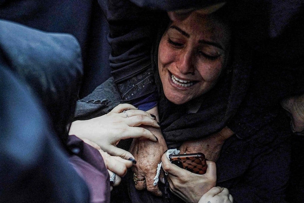 A mother is comforted by other women as she mourns the death of her child in an Israeli bombardment in Nuseirat in the central Gaza Strip. Photo: AFP