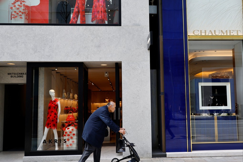 An elderly man walking at a shopping district in Tokyo. Photo: Reuters