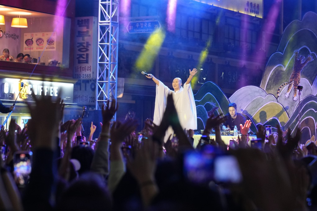 NewJeansNim, a comedian and a DJ whose real name is Youn Sung Ho, performs dressed as a monk in Seoul. Religious belief in South Korea has been on the decline for years but that might change as social media fuels interest in Buddhism among young people. Photo: AP