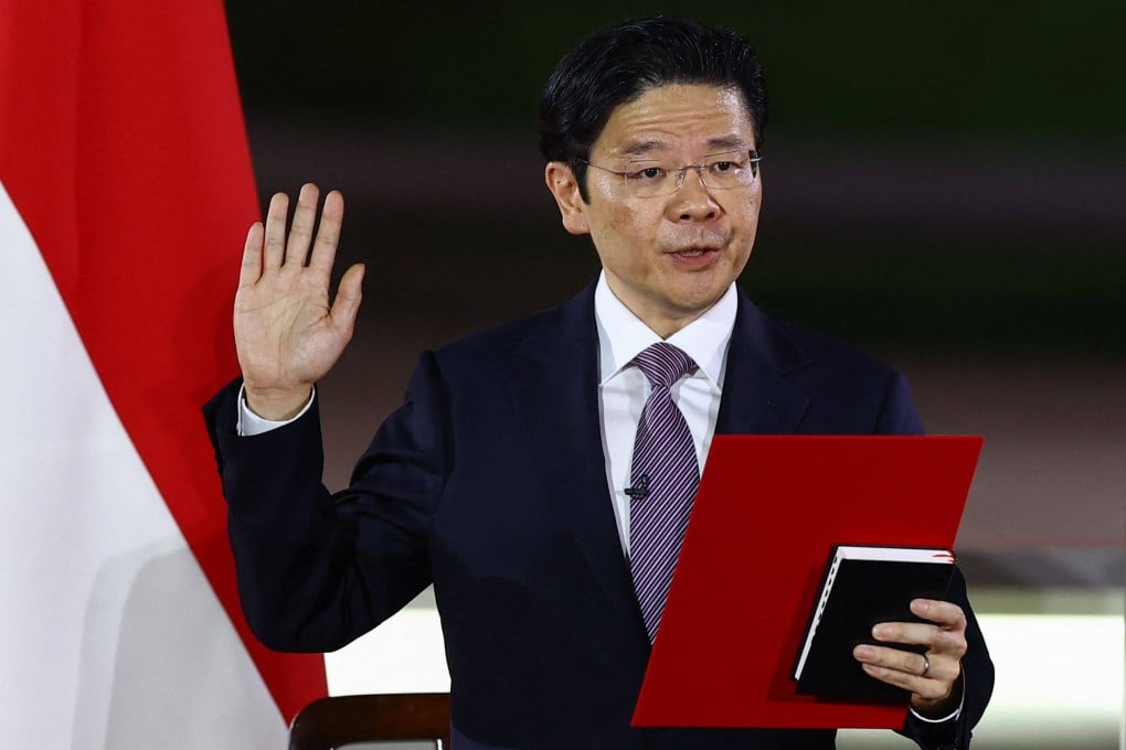 Singapore’s new Prime Minister Lawrence Wong is sworn during a ceremony at the Istana on Wednesday. Photo: AFP