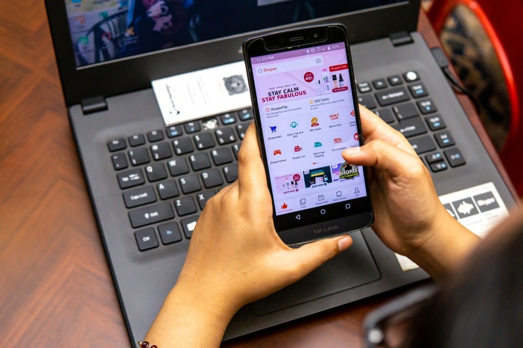 A girl in Malaysia using a smartphone to search and buy things online. Photo: Shutterstock