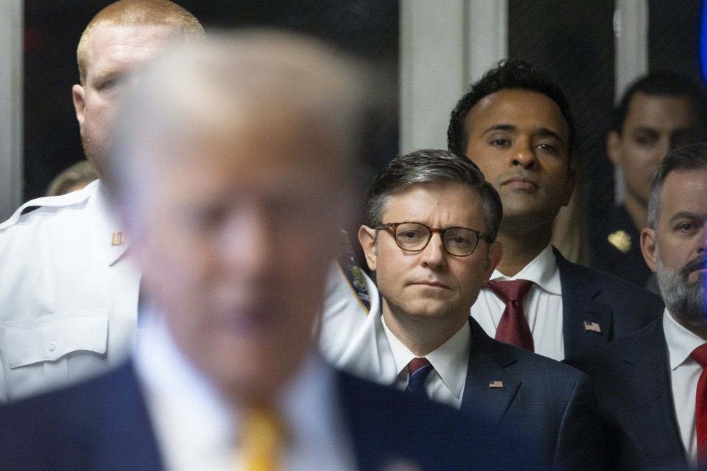 House Speaker Mike Johnson and Vivek Ramaswamy as Donald Trump arrives at the Manhattan Criminal Court in New York. Photo: AP