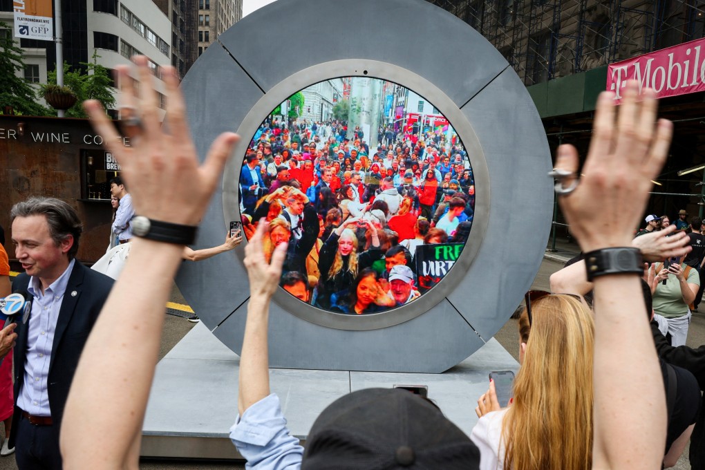 New Yorkers greet people in Dublin via a Portal in Manhattan. Photo: Reuters