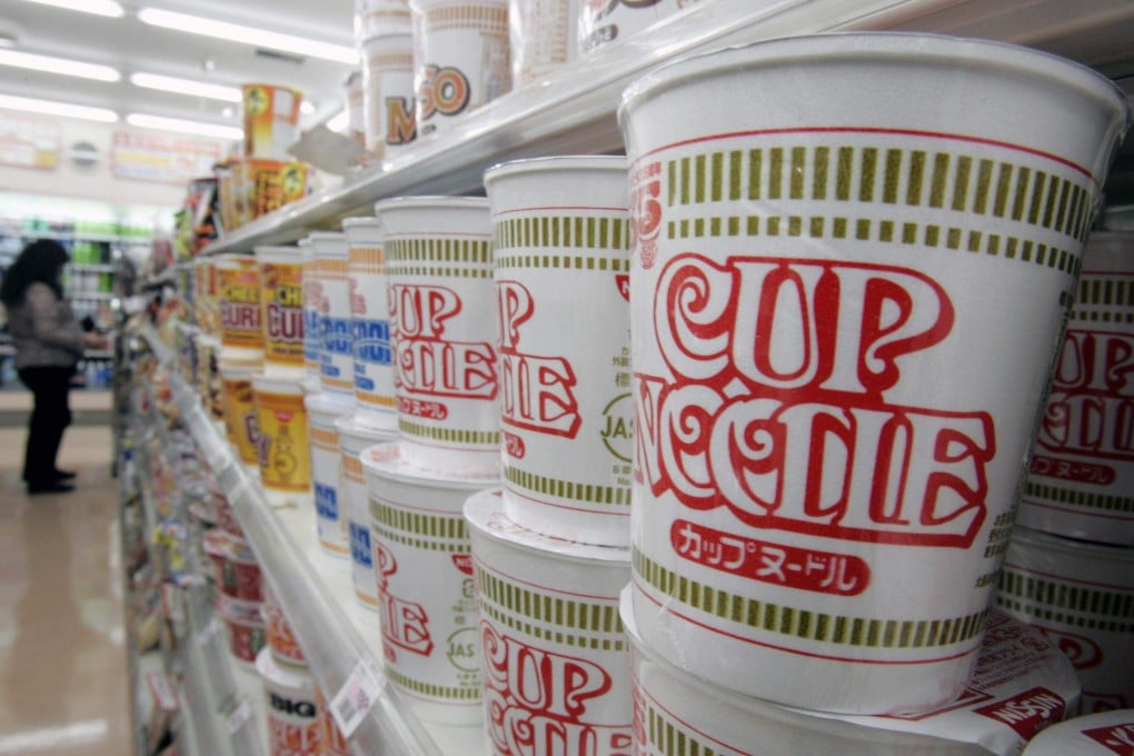 Nissin cup noodles stacked at a convenience store in Tokyo. Photo: Reuters