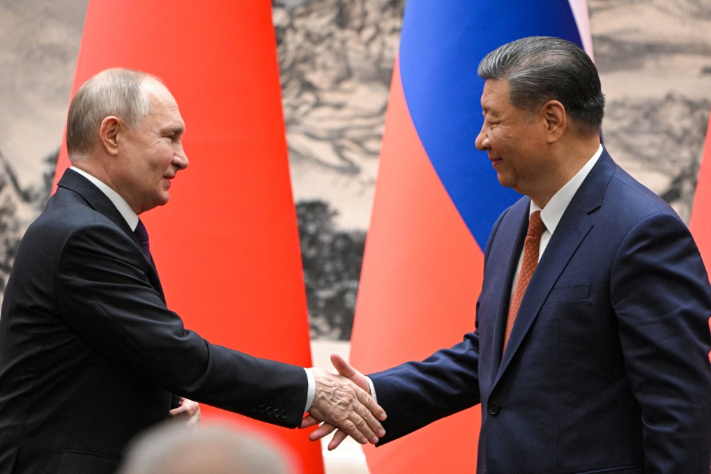 Russian President Vladimir Putin shakes hands with Chinese President Xi Jinping during a meeting in Beijing on Thursday. Photo: Reuters